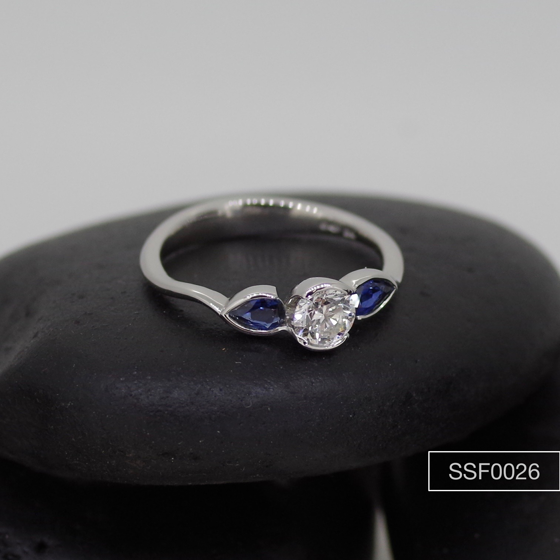 Brilliant cut Diamond & pear cut Sapphire three stone ring.