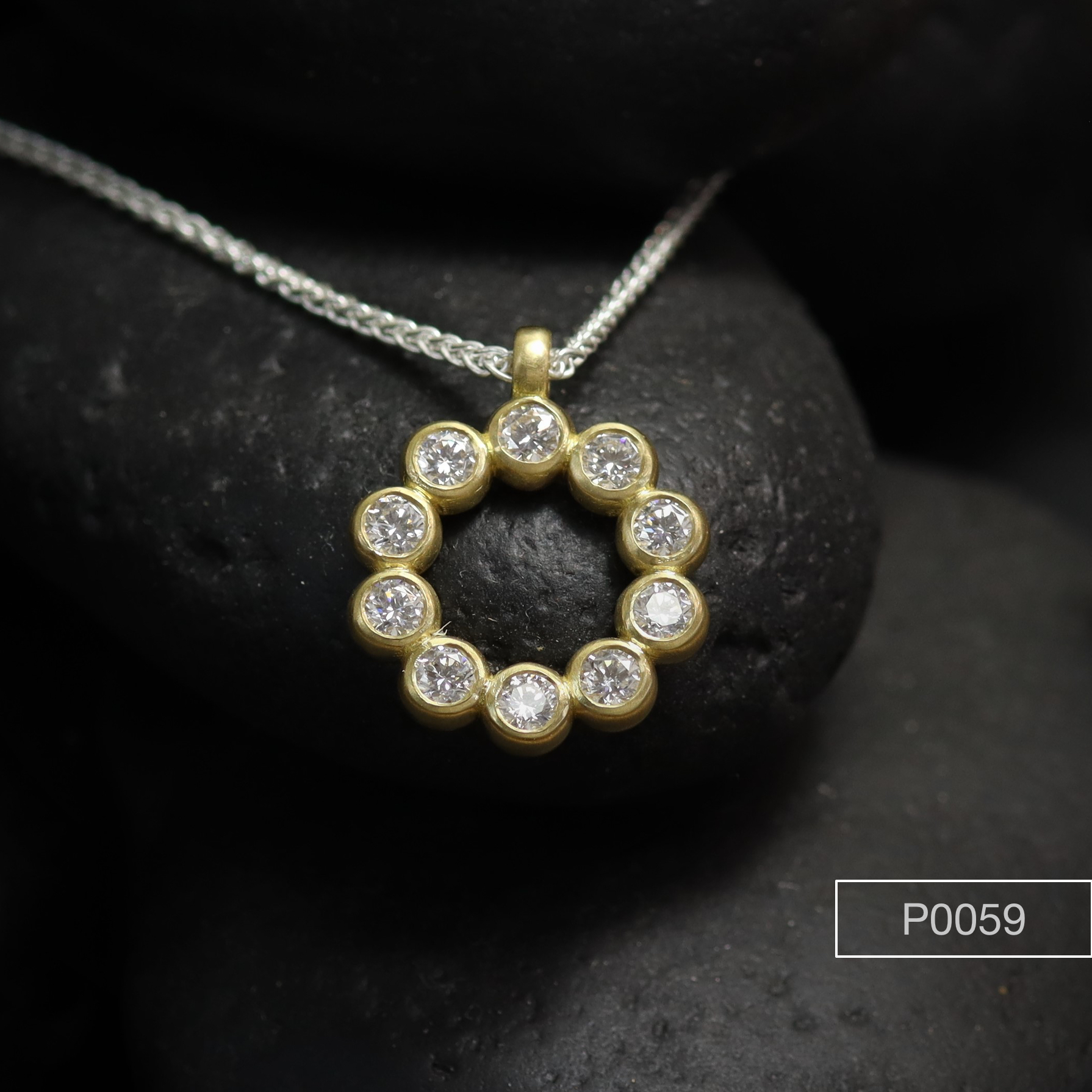 Frosted 18ct gold, Diamond set pendent.